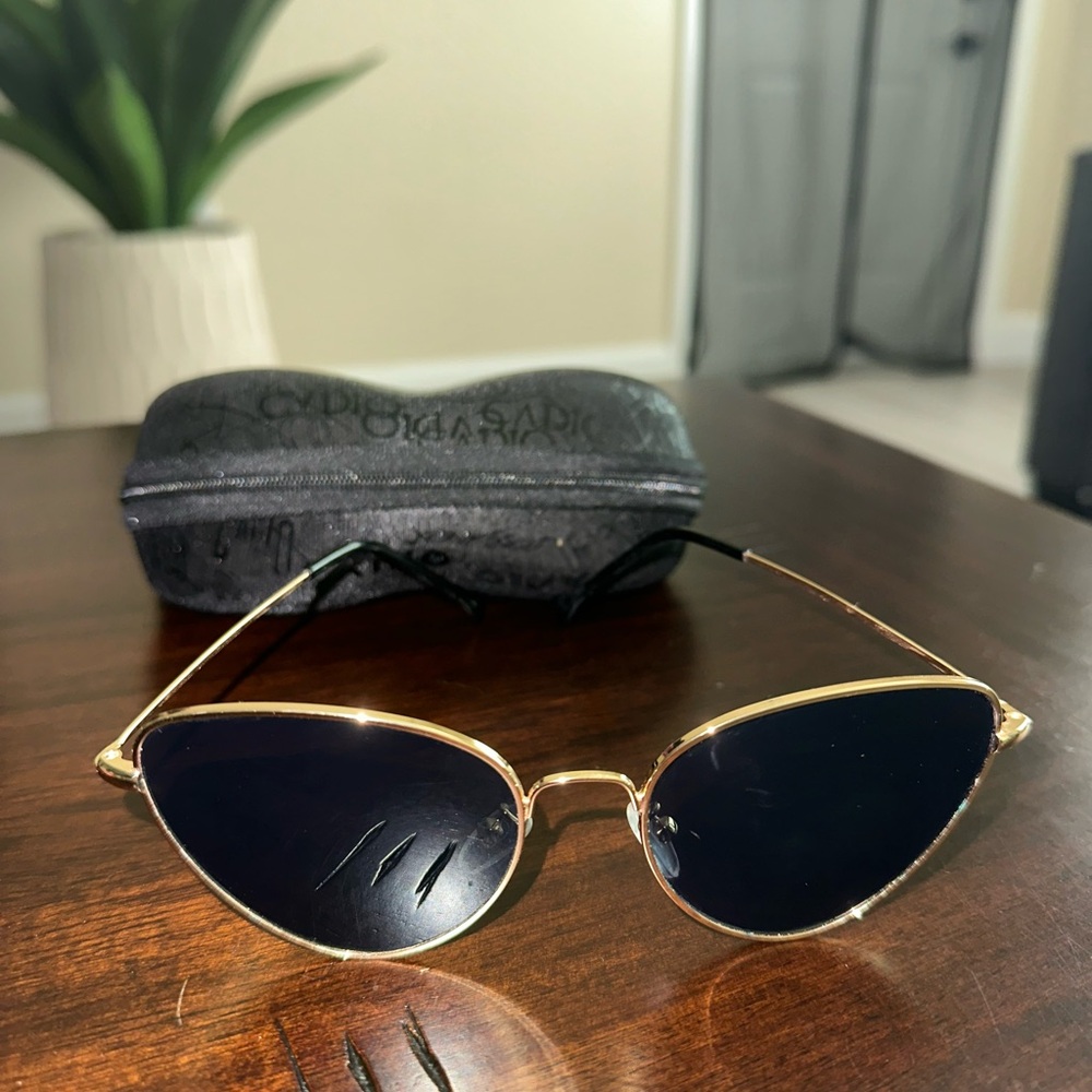 Gold rim sunglasses